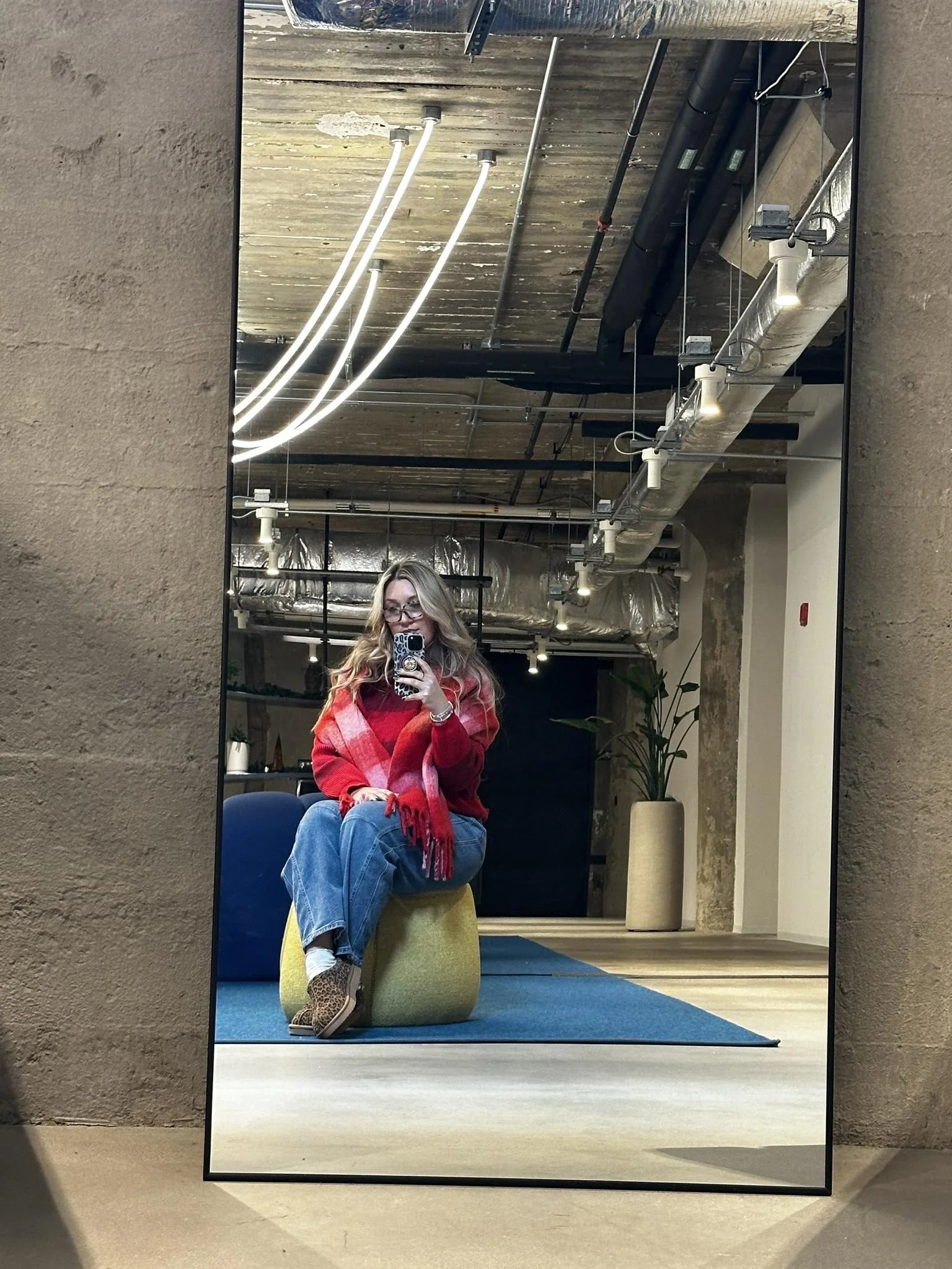 crystal ortiz sits on a couch | socialhart