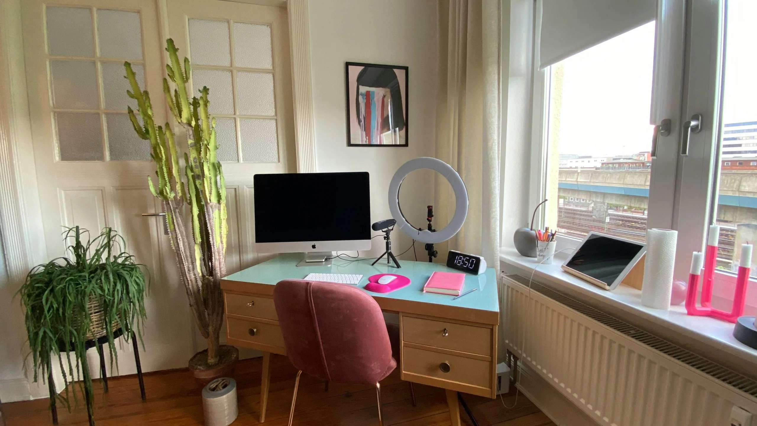 desk with computer looking out window